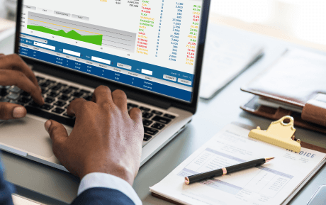 Computer screen showing financial reporting dashboards