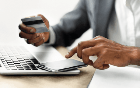 Professional working on transaction analysis with laptop